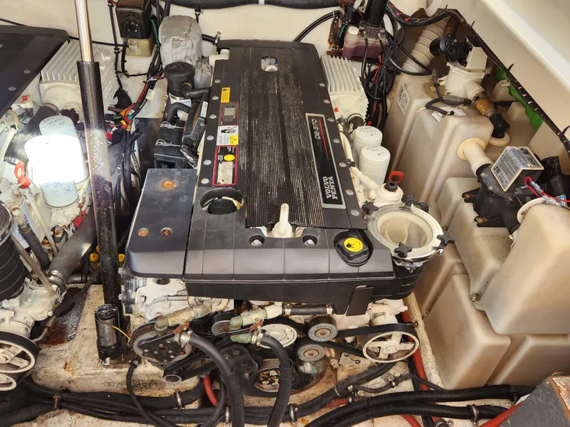 Slide: The Image of Engine compartment of a 2008 Riviera M470 boat, showcasing detailed mechanical components. - 29