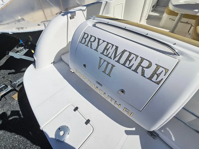 Slide: The Image of 2008 Riviera M470 boat with "BRYEMERE VII" name, docked in Portsmouth, RI. - 4