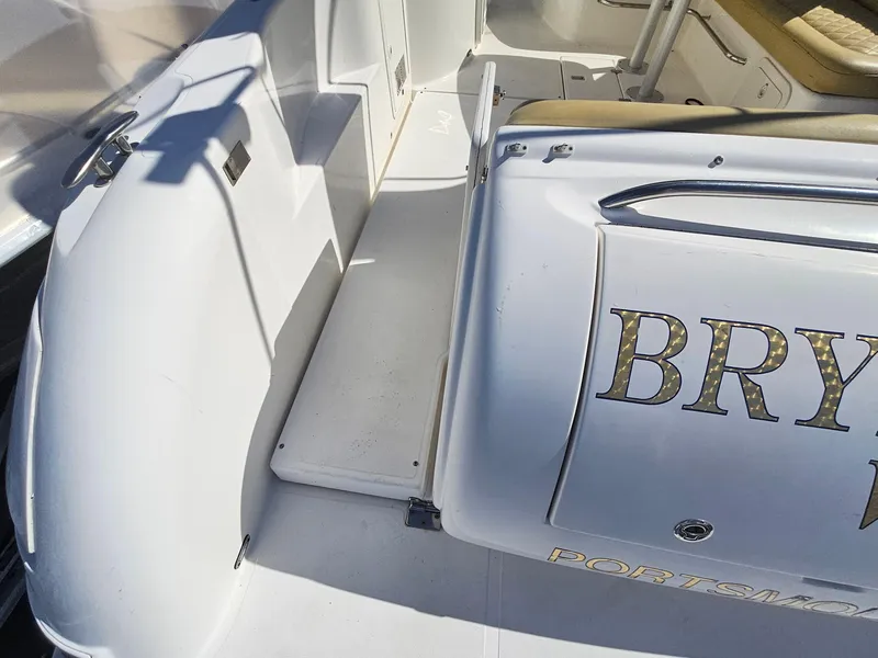 Slide: The Image of 2008 Riviera M470 boat interior with seating and deck details. - 5