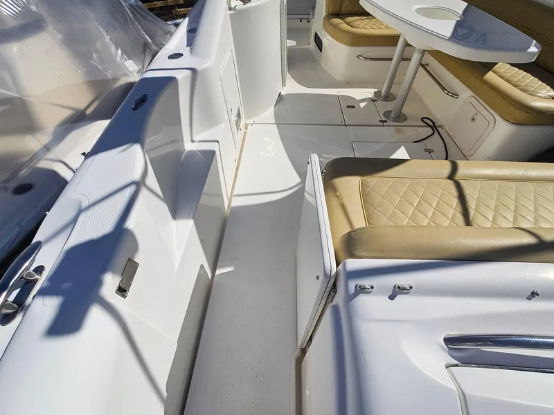 Slide: The Image of 2008 Riviera M470 boat interior with beige seating and white deck. - 6