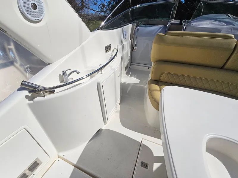 Slide: The Image of 2008 Riviera M470 yacht interior with beige seating and sleek white fixtures. - 8