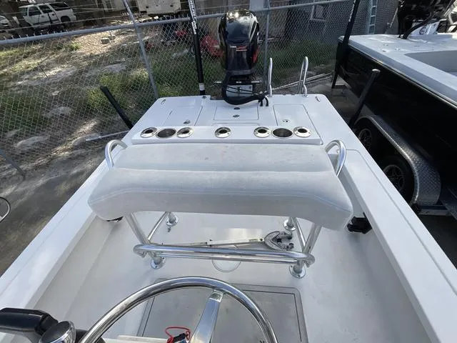 Slide: The Image of 2009 Pathfinder 2100 Fusion boat interior with steering wheel and motor. - 11