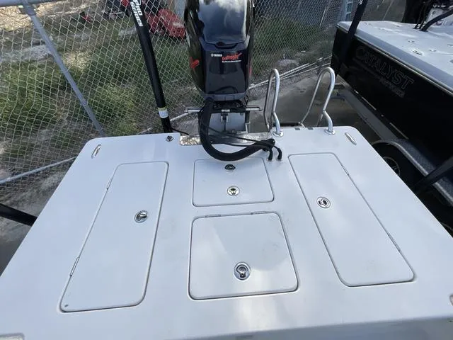 Slide: The Image of 2009 Pathfinder 2100 Fusion boat with outboard motor and storage compartments. - 5