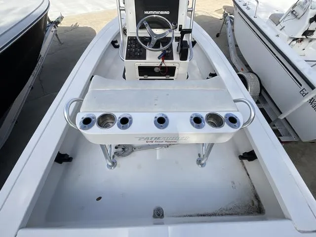 Slide: The Image of 2009 Pathfinder 2100 Fusion boat interior with steering console and rod holders. - 7
