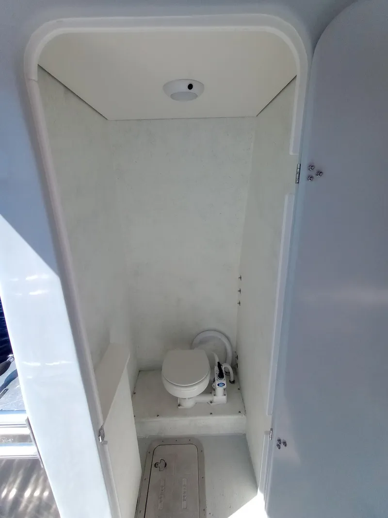 Slide: The Image of Compact marine bathroom with toilet in a Custom 34 model, 2025. - 9