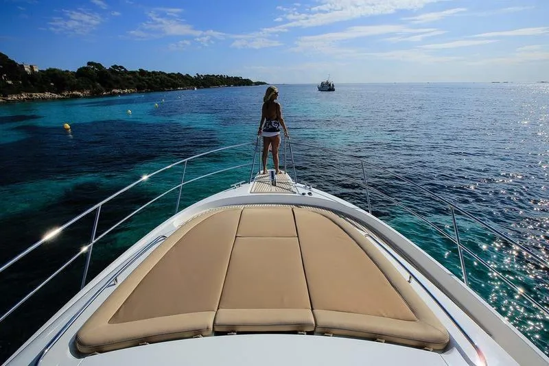 Slide: The Image of Woman on Nimbus 405 Flybridge yacht, 2025 model, enjoying scenic ocean view. - 5