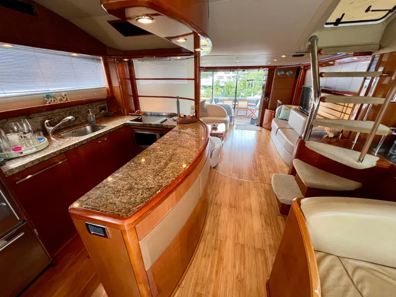 Slide: The Image of Luxurious interior of 2008 Viking Sport Cruisers 70 Motor Yacht with modern kitchen and seating. - 14