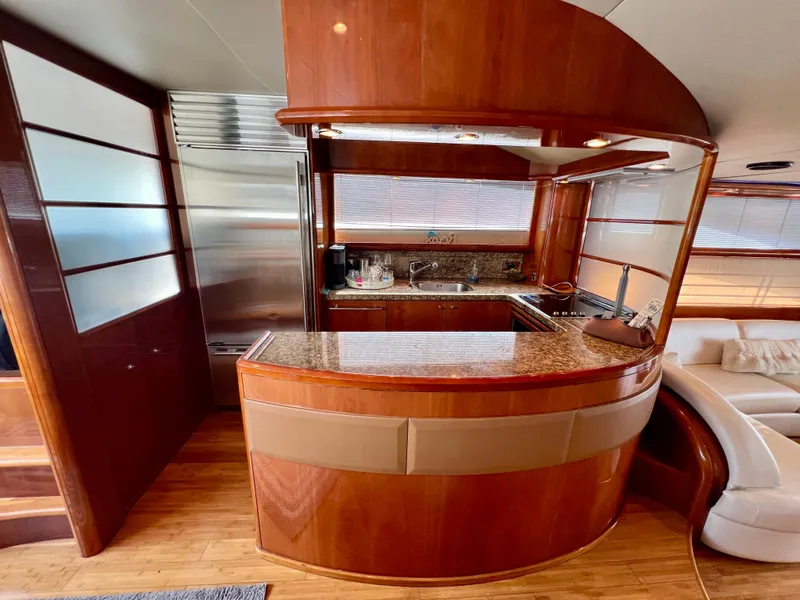 Slide: The Image of Luxurious kitchen interior of 2008 Viking Sport Cruisers 70 Motor Yacht with wood finish. - 17