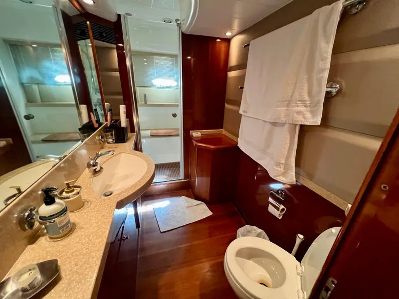 Slide: The Image of Luxurious bathroom in 2008 Viking Sport Cruisers 70 Motor Yacht with elegant wood finishes. - 24