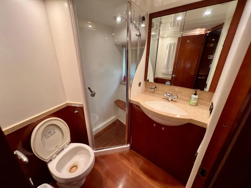 Slide: The Image of Bathroom interior of 2008 Viking Sport Cruisers 70 Motor Yacht with shower and vanity. - 29