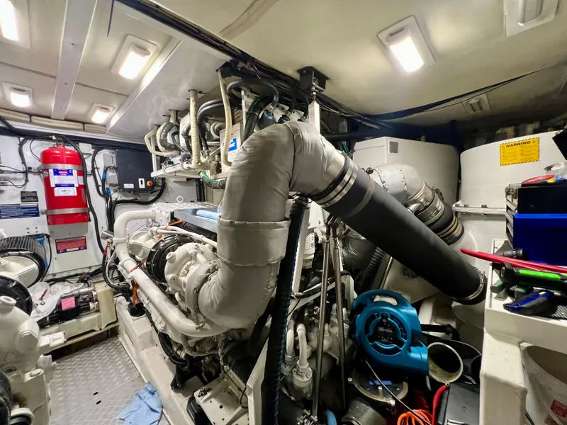 Slide: The Image of Engine room of 2008 Viking Sport Cruisers 70 Motor Yacht, featuring complex machinery and equipment. - 31