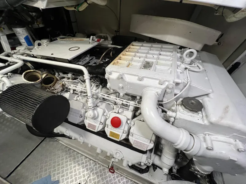 Slide: The Image of Engine room of 2008 Viking Sport Cruisers 70 Motor Yacht, showcasing detailed machinery components. - 33