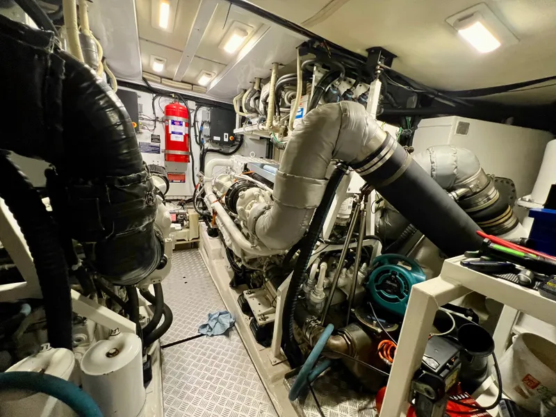 Slide: The Image of Engine room of 2008 Viking Sport Cruisers 70 Motor Yacht, featuring complex machinery and equipment. - 35