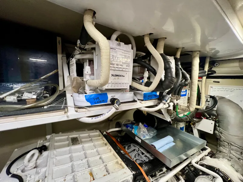 Slide: The Image of Engine room of 2008 Viking Sport Cruisers 70 Motor Yacht, showcasing complex wiring and components. - 37