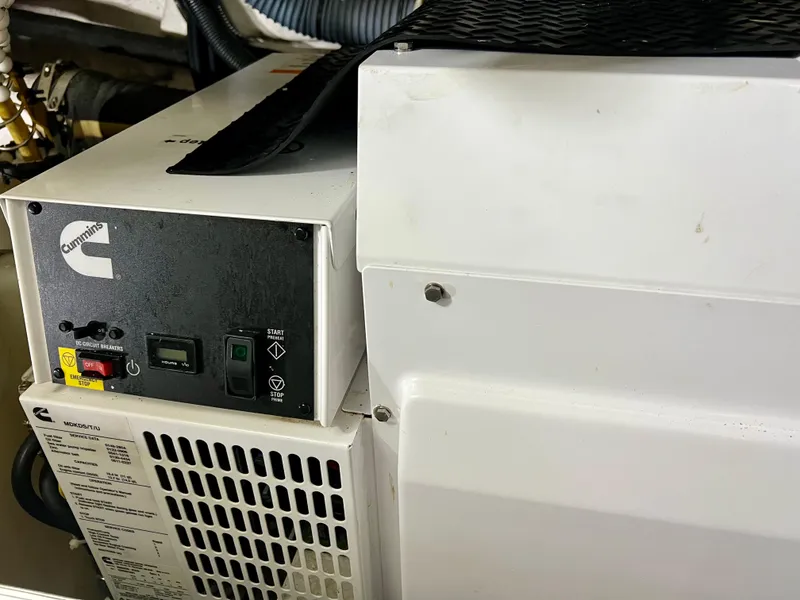 Slide: The Image of Cummins generator in 2008 Viking Sport Cruisers 70 Motor Yacht engine room. - 39