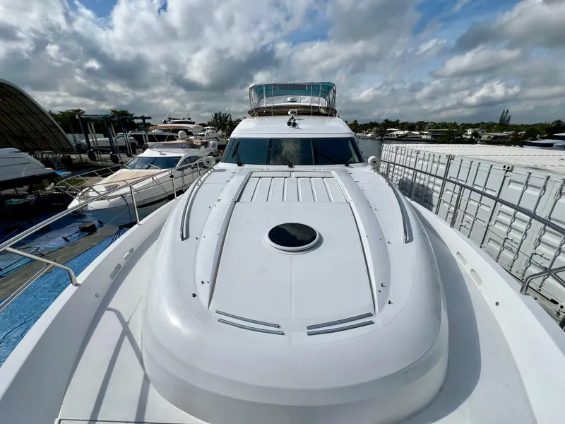 Slide: The Image of 2008 Viking Sport Cruisers 70 Motor Yacht docked under cloudy skies. - 7
