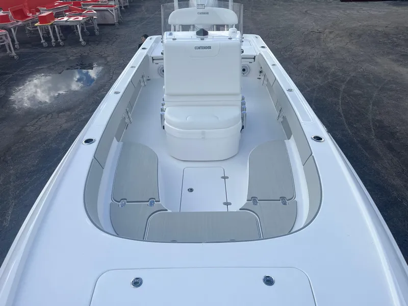 Slide: The Image of 2025 Contender 26 Bay boat dashboard with dual screens and steering wheel. - 8
