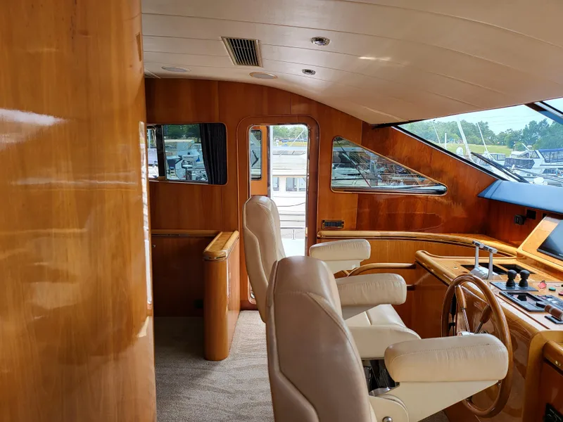 Slide: The Image of Interior of 2000 Horizon 74 Motor Yacht with wooden finish and captain's chairs. - 14