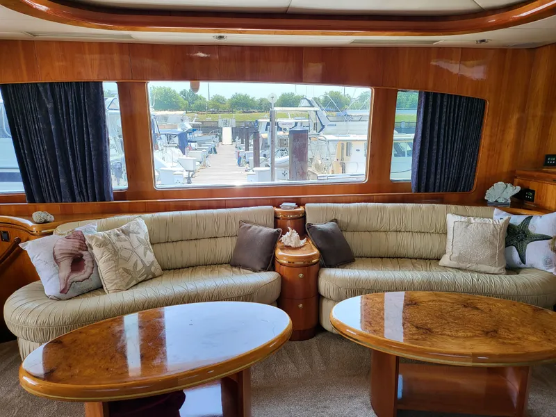 Slide: The Image of Luxurious interior of 2000 Horizon 74 Motor Yacht with plush seating and elegant wood finishes. - 16