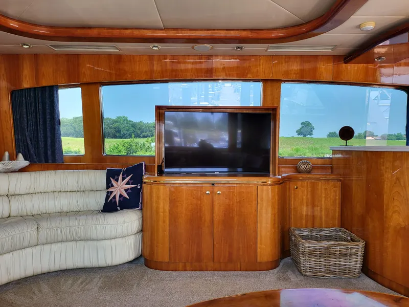 Slide: The Image of Luxurious interior of 2000 Horizon 74 Motor Yacht with TV and scenic window view. - 18