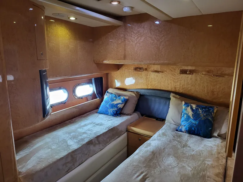 Slide: The Image of Luxurious cabin interior of 2000 Horizon 74 Motor Yacht with twin beds and elegant decor. - 26