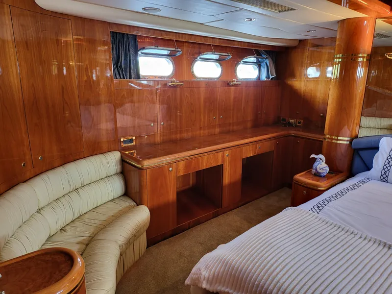 Slide: The Image of Luxurious interior of 2000 Horizon 74 Motor Yacht with wood paneling and plush seating. - 28