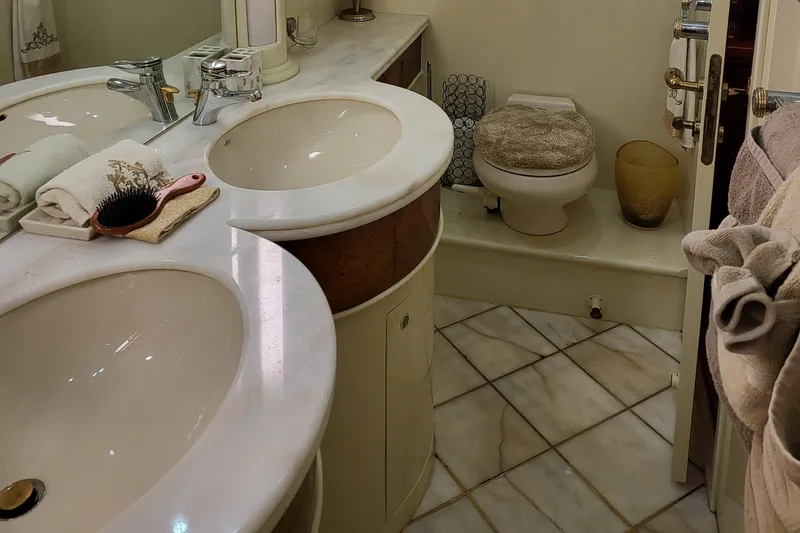 Slide: The Image of Luxurious bathroom in 2000 Horizon 74 Motor Yacht with dual sinks and elegant fixtures. - 35