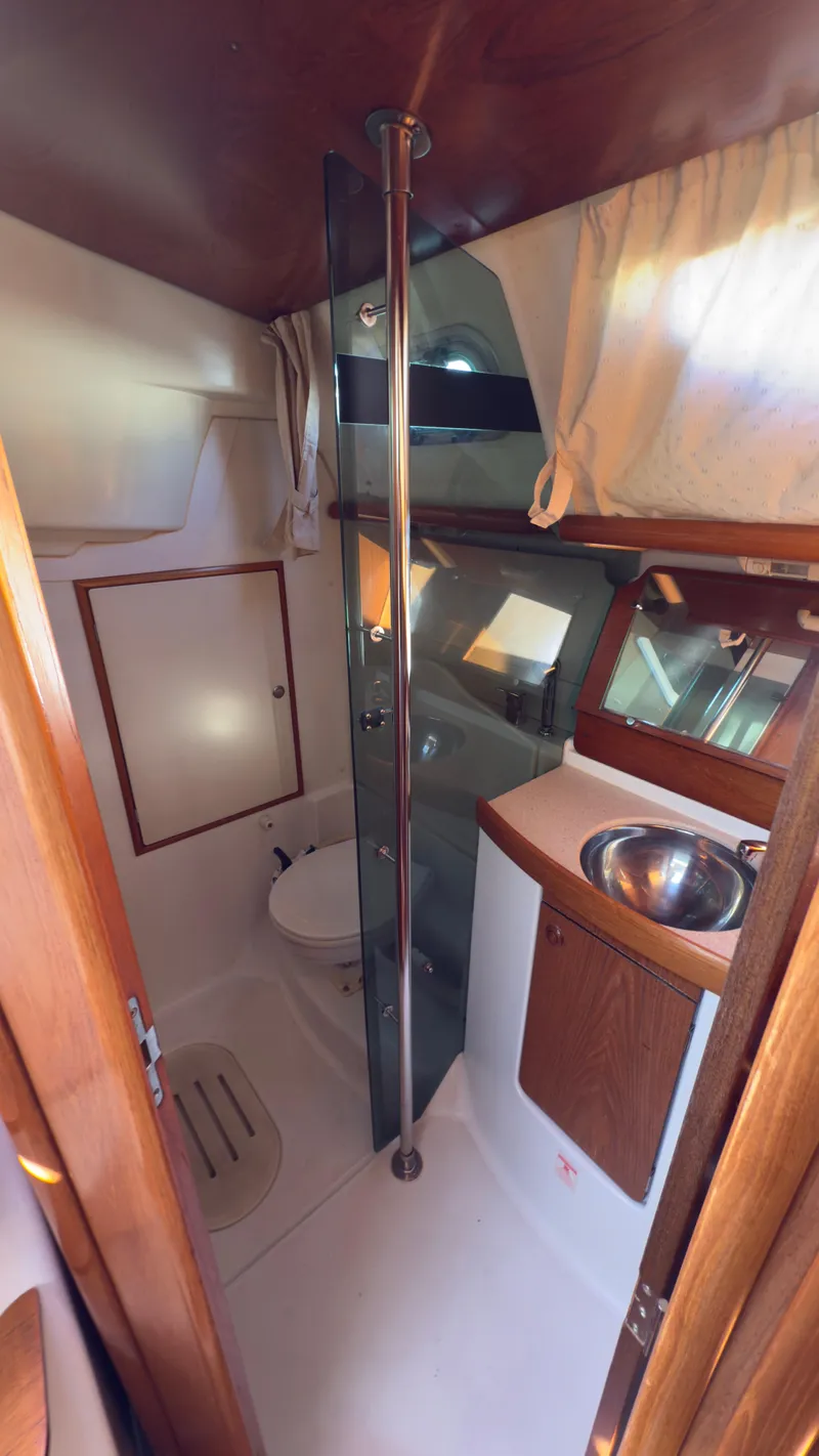 Slide: The Image of Interior of 2004 Jeanneau Sun Fast 35 yacht bathroom with sink and toilet. - 15