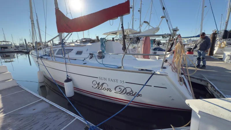 Slide: The Image of 2004 Jeanneau Sun Fast 35 sailboat docked at marina, sunny day. - 4