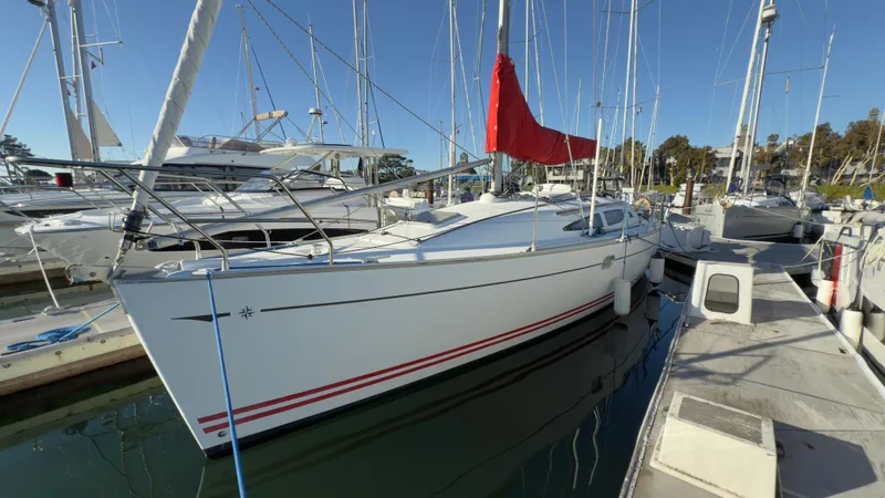 Slide: The Image of 2004 Jeanneau Sun Fast 35 sailboat docked with red sail cover. - 5