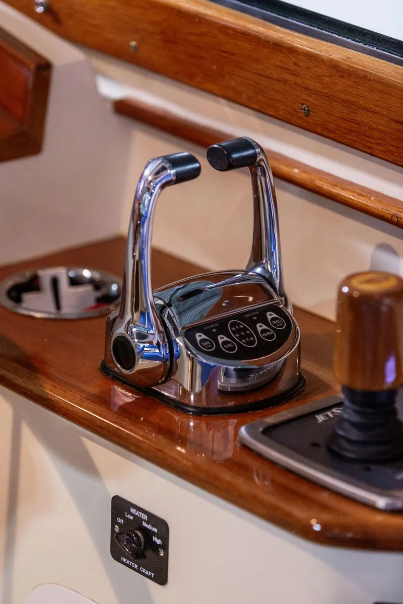 Slide: The Image of Interior view of 2014 Hinckley Talaria 34, showcasing elegant woodwork and modern design. - 10