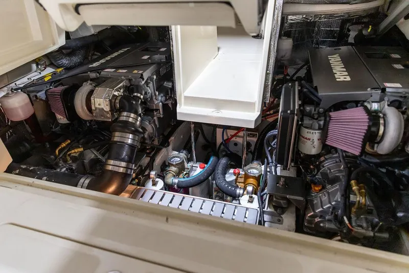 Slide: The Image of Engine compartment of a 2014 Hinckley Talaria 34, featuring dual Yanmar engines. - 22