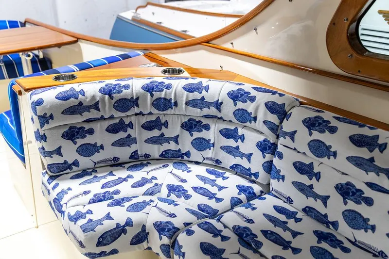 Slide: The Image of Interior of 2014 Hinckley Talaria 34 boat with blue seats and wooden dashboard. - 7