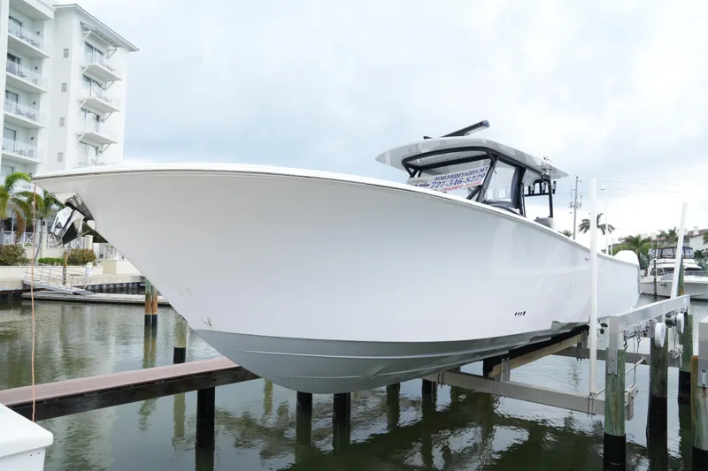 Slide: The Image of 2023 Front Runner 39 CC boat docked at marina, side view. - 0