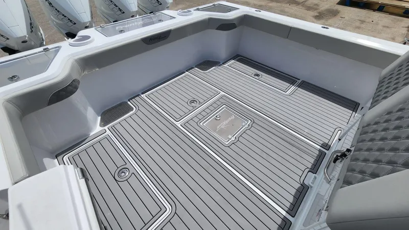 Slide: The Image of 2023 Front Runner 39 CC boat deck with sleek, modern design and storage compartments. - 16