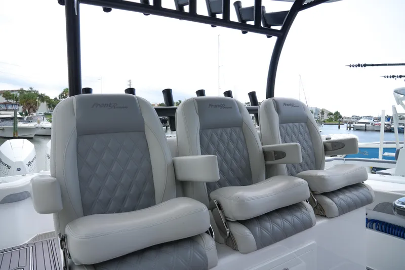 Slide: The Image of 2023 Front Runner 39 CC boat with luxurious gray seating and armrests. - 2