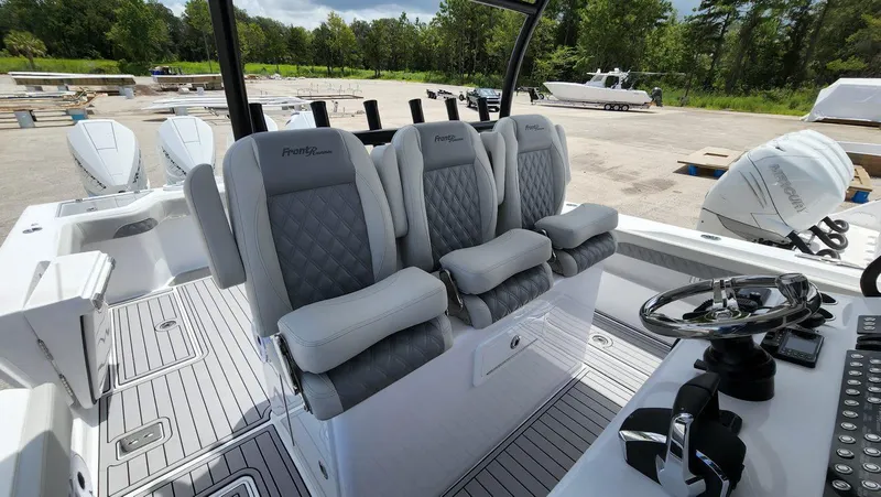 Slide: The Image of 2023 Front Runner 39 CC boat interior with luxury seating and modern controls. - 21