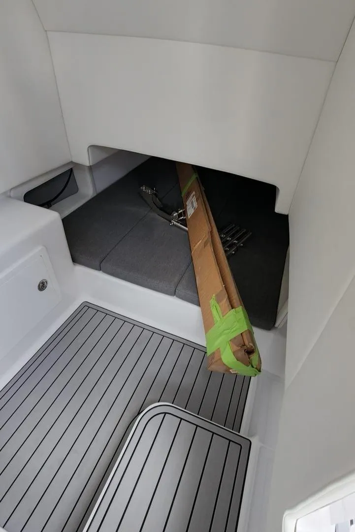 Slide: The Image of 2023 Front Runner 39 CC interior with sleek flooring and storage area. - 24