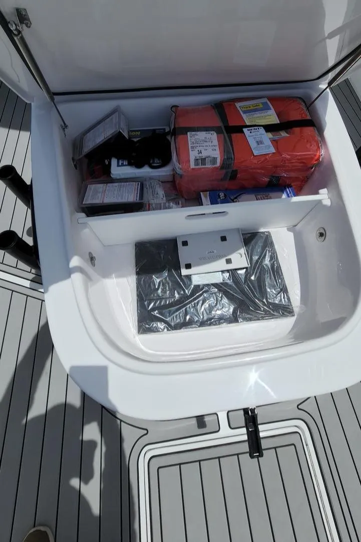 Slide: The Image of Storage compartment on 2023 Front Runner 39 CC boat with safety equipment. - 25