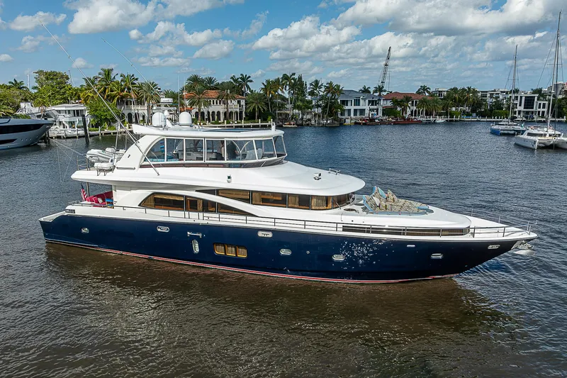 Slide: The Image of Luxurious 2013 Johnson 78 Cockpit Motoryacht cruising on a scenic waterway. - 0