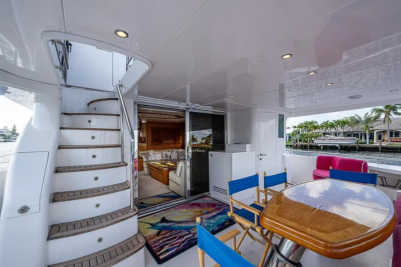 Slide: The Image of Luxurious 2013 Johnson 78 Cockpit Motoryacht with elegant outdoor seating and staircase. - 14