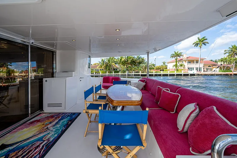 Slide: The Image of Luxurious 2013 Johnson 78 Cockpit Motoryacht with spacious outdoor seating and vibrant decor. - 15