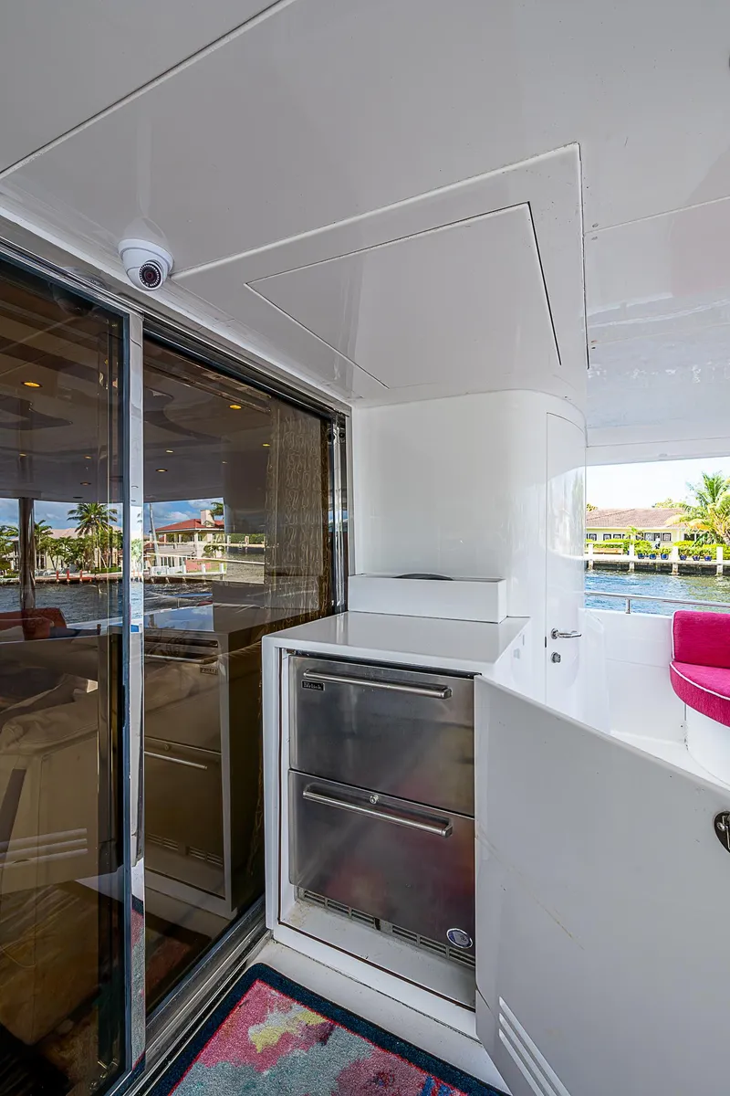 Slide: The Image of 2013 Johnson 78 Cockpit Motoryacht interior with modern design and waterfront view. - 16