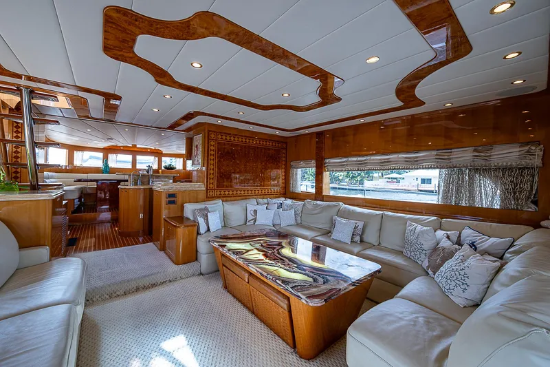 Slide: The Image of Luxurious interior of 2013 Johnson 78 Cockpit Motoryacht with elegant wood accents and plush seating. - 2