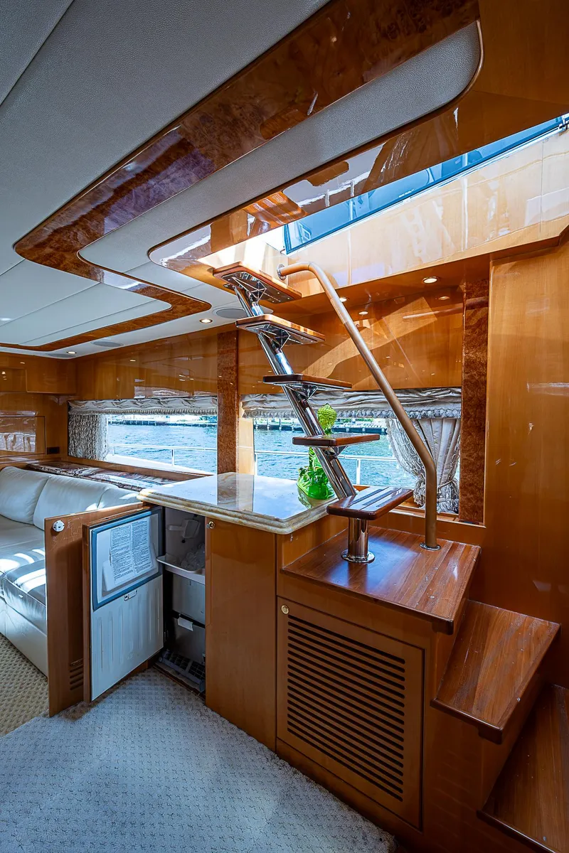 Slide: The Image of Luxurious interior of 2013 Johnson 78 Cockpit Motoryacht with modern staircase and wood finishes. - 22