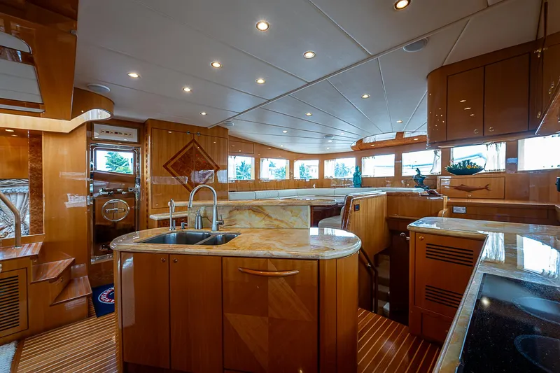 Slide: The Image of Luxurious interior of 2013 Johnson 78 Cockpit Motoryacht with modern kitchen and elegant wood finishes. - 24
