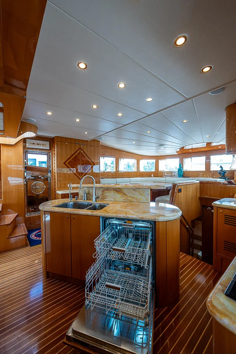 Slide: The Image of Luxurious interior of 2013 Johnson 78 Cockpit Motoryacht with modern kitchen amenities. - 30