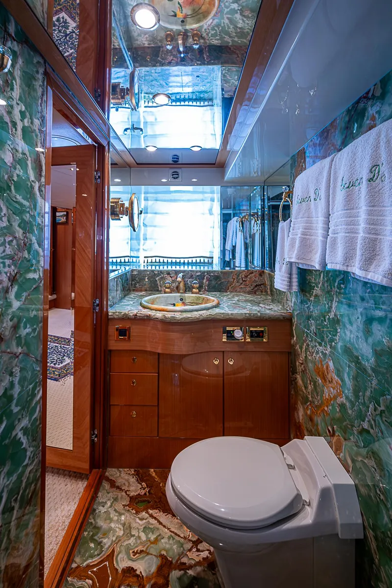 Slide: The Image of Luxurious bathroom in 2013 Johnson 78 Cockpit Motoryacht with elegant marble decor. - 39