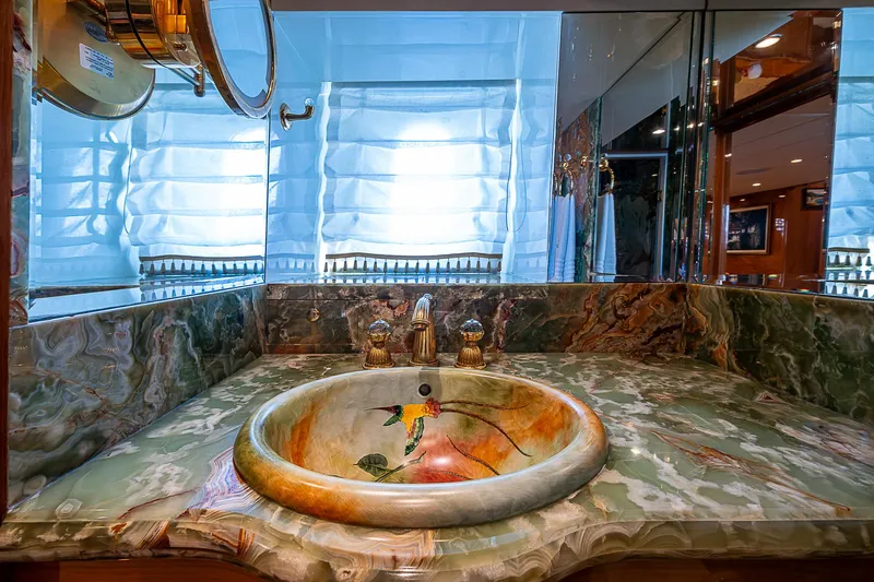Slide: The Image of Luxurious bathroom sink on 2013 Johnson 78 Cockpit Motoryacht with elegant marble countertop. - 40