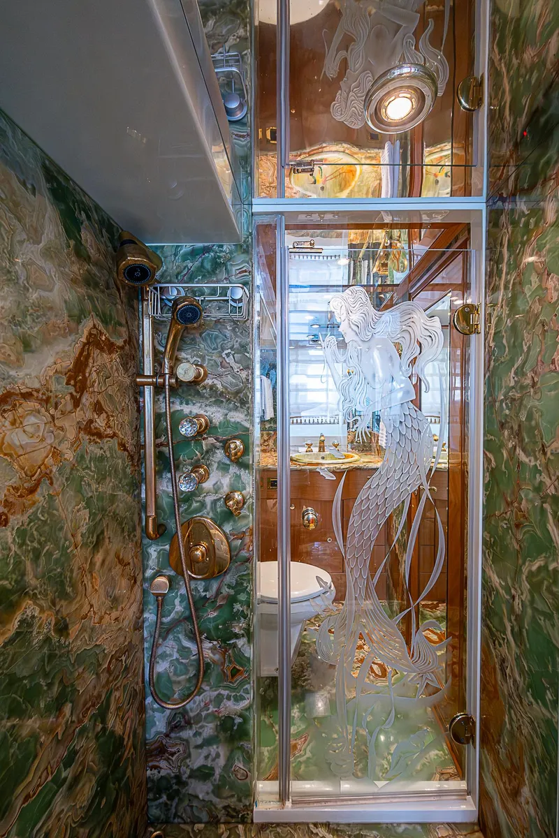 Slide: The Image of Luxurious bathroom in 2013 Johnson 78 Cockpit Motoryacht with ornate glass shower door. - 41